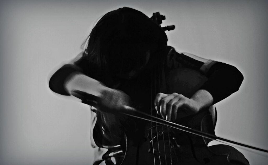black and white image of cello player